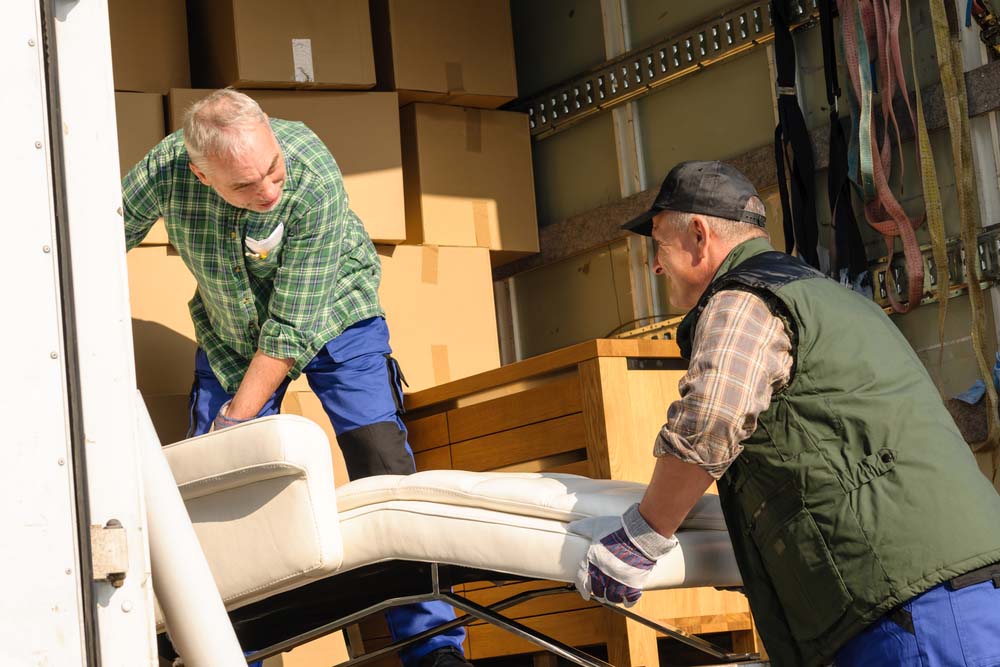Unloading a Sofa — Reliable Removalist Services in Morisset piano removals