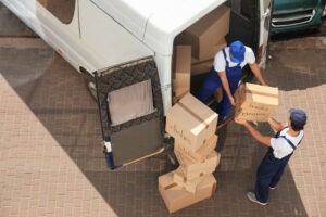 Putting Box on the Van — Reliable Removalist Services in Morisset